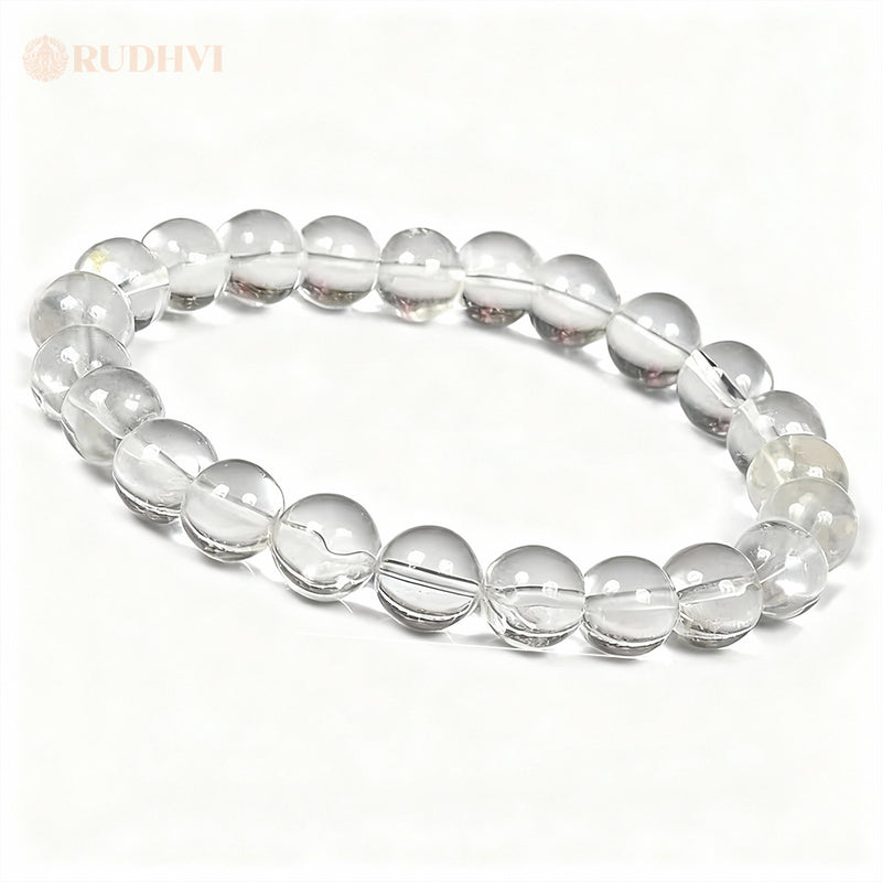 Clear quartz bracelet on a white background with 'RUDHVI' branding.